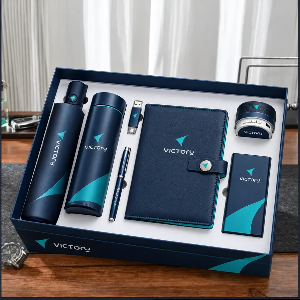 Navy and teal branded executive gift box with umbrella, flask, pen, USB, notebook, speaker and power bank