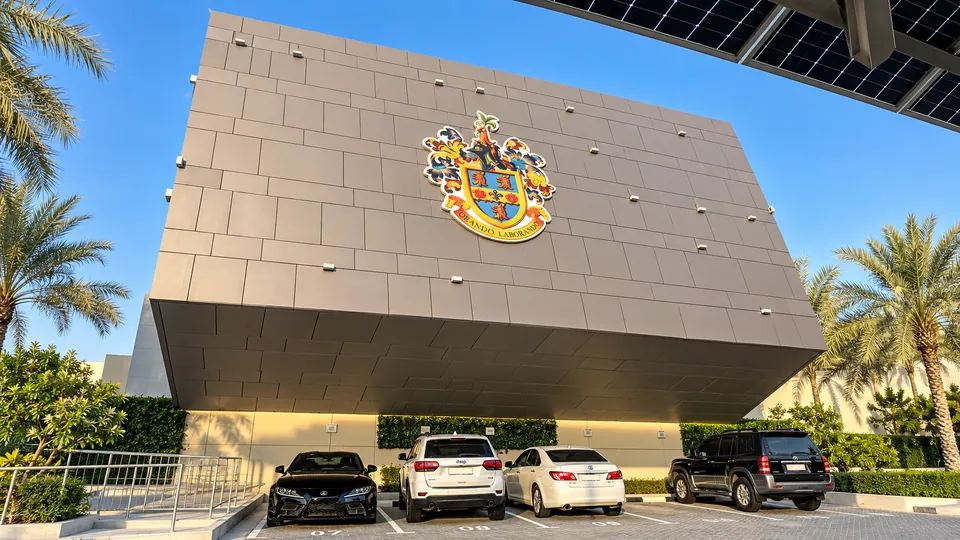 Rugby School Dubai crest sign on the school building facade, Nad Al Sheba, Dubai